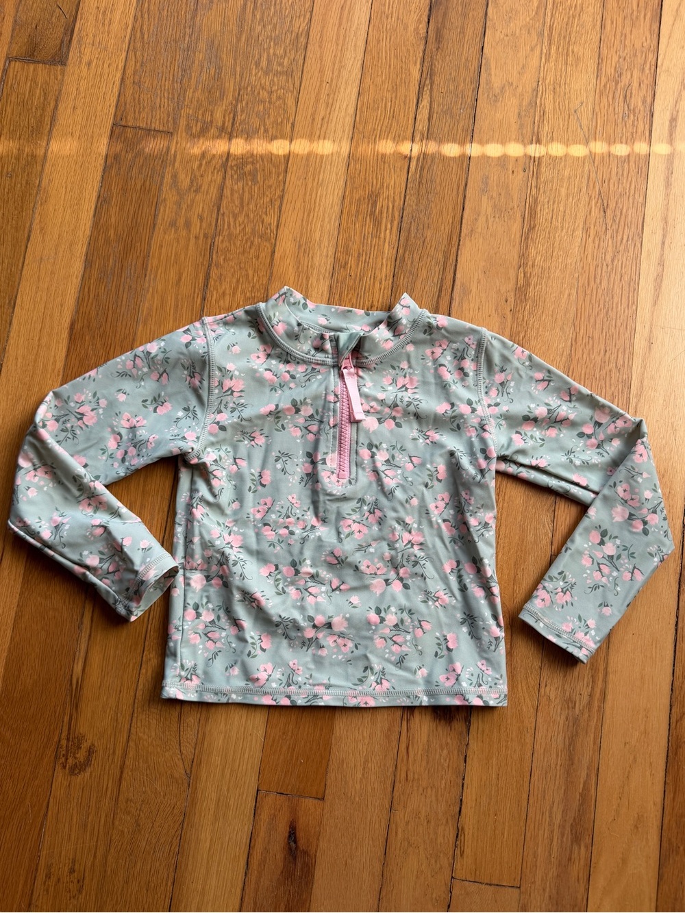 Ruffle butts green and pink floral quarter zip swim shirt